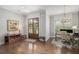 Inviting foyer featuring hardwood floors, an office view, and a decorative double-door entry at 1660 Chandler Rd, Lawrenceville, GA 30045