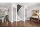 Welcoming foyer with hardwood floors, view of the staircase, and neutral wall paint at 1660 Chandler Rd, Lawrenceville, GA 30045