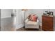 Cozy sitting area featuring a comfortable chair, side table, and wood-look flooring at 1660 Chandler Rd, Lawrenceville, GA 30045