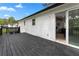 New back deck with black railings and sliding glass door with a view to interior living space at 2014 Fence Rd, Dacula, GA 30019