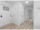 Entryway featuring white trim, light flooring and an exterior door with window at 2014 Fence Rd, Dacula, GA 30019