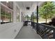 Cozy covered front porch with decorative railing offering a charming outdoor seating area with neighborhood views at 2014 Fence Rd, Dacula, GA 30019