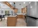 Modern kitchen with stainless steel appliances, quartz countertops, and custom cabinets with a kitchen island at 2014 Fence Rd, Dacula, GA 30019