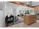 Open-concept living space featuring a modern kitchen, dining area, and comfortable seating with beautiful finishes at 2014 Fence Rd, Dacula, GA 30019