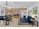 Bright open-concept living space featuring a modern kitchen, dining area, and comfortable seating with beautiful finishes at 2014 Fence Rd, Dacula, GA 30019