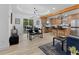 Bright and open living space featuring a modern kitchen, dining area, and a cozy seating area at 2014 Fence Rd, Dacula, GA 30019