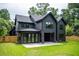 Stately home with a dark exterior, spacious backyard, and covered patio for outdoor living at 206 Mead Rd, Decatur, GA 30030