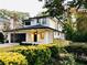 Beautifully landscaped home boasts a two-story facade, a black garage door, and a welcoming front porch at 206 Mead Rd, Decatur, GA 30030