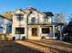 Elegant home features a welcoming front porch, manicured lawn, and timeless architectural details at 206 Mead Rd, Decatur, GA 30030