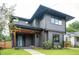 Contemporary home with a wood-accented porch, minimalist landscaping, and a blue front door at 206 Mead Rd, Decatur, GA 30030