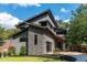 Modern home with stone accents, a sleek garage door, and a well-maintained lawn at 206 Mead Rd, Decatur, GA 30030