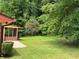 Expansive backyard featuring a lush lawn and mature trees at 3190 Cheru Ct, Decatur, GA 30034