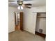 Bedroom with carpeted floors, closet and ceiling fan with a light at 3190 Cheru Ct, Decatur, GA 30034