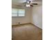 Bedroom features neutral carpet, a ceiling fan and a window for natural light at 3190 Cheru Ct, Decatur, GA 30034