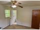 Bedroom with carpet, a window with blinds, and adjacent bathroom access at 3190 Cheru Ct, Decatur, GA 30034