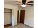 Bedroom featuring a ceiling fan, closet with bi-fold doors and closet rod at 3190 Cheru Ct, Decatur, GA 30034