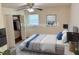 Virtual staging of a bedroom with a bed, closet, and a ceiling fan at 3190 Cheru Ct, Decatur, GA 30034