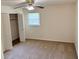 A bright bedroom features a ceiling fan and closet with folding doors at 3190 Cheru Ct, Decatur, GA 30034