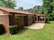Rear exterior of brick home with an adjacent outdoor patio at 3190 Cheru Ct, Decatur, GA 30034