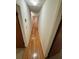 Hallway with hardwood floors, neutral walls, and convenient access to bedrooms at 3190 Cheru Ct, Decatur, GA 30034