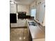 Well-lit kitchen with white cabinets and a stainless steel sink at 3190 Cheru Ct, Decatur, GA 30034