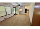 Open living room with large windows and an adjacent kitchen area at 3190 Cheru Ct, Decatur, GA 30034
