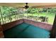 Relaxing screened porch with brick flooring and ceiling fan at 3190 Cheru Ct, Decatur, GA 30034