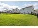 Spacious backyard featuring a well-maintained lawn, and a fence, ideal for outdoor activities at 5025 Bryce Ln, Cumming, GA 30040