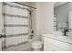 Bathroom featuring a shower-tub combo, a white vanity with a sink, and modern fixtures for a clean aesthetic at 5025 Bryce Ln, Cumming, GA 30040