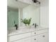 Bright bathroom features double sinks, quartz countertops and modern fixtures at 5025 Bryce Ln, Cumming, GA 30040