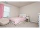 Comfortable bedroom with a twin bed, large window, and neutral decor at 5025 Bryce Ln, Cumming, GA 30040