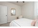 Cozy bedroom with neutral tones, a mirror, and an accent chair providing a relaxing and inviting atmosphere at 5025 Bryce Ln, Cumming, GA 30040