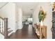 Inviting entryway with hardwood floors, a staircase, and decorative table, creating a warm welcome at 5025 Bryce Ln, Cumming, GA 30040