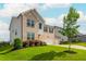 Charming two-story home showcasing brick accents, a two-car garage and a well-manicured lawn at 5025 Bryce Ln, Cumming, GA 30040