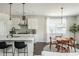Bright eat-in kitchen area with modern lighting and stainless steel appliances at 5025 Bryce Ln, Cumming, GA 30040