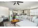 Open living area with kitchen island and stainless steel appliances at 5025 Bryce Ln, Cumming, GA 30040