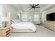 Bright main bedroom with a large bed, side tables, and a dresser offering space for relaxation and storage at 5025 Bryce Ln, Cumming, GA 30040