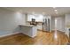 Modern kitchen featuring stainless steel appliances, granite countertops, and stylish white cabinetry at 6010 Spalding Dr, Atlanta, GA 30350