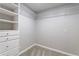 Corner view of walk-in closet showing wire shelving for folded clothes and accessories at 6010 Spalding Dr, Atlanta, GA 30350