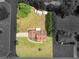 Overhead view of property showing expansive lot with tree coverage, additional outbuildings and surrounding neighborhood at 710 Freeman Dr, Covington, GA 30016