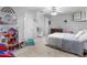 Bedroom with toys, comfortable bed, and neutral walls, creating a playful and cozy space at 710 Freeman Dr, Covington, GA 30016