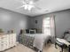 Bedroom featuring a ceiling fan, a day bed, and neutral carpet flooring at 710 Freeman Dr, Covington, GA 30016