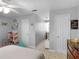 Bedroom with neutral walls, featuring a toy area and comfortable furniture at 710 Freeman Dr, Covington, GA 30016