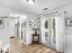 Bright dining area with french doors and hardwood floors provides access to the outdoor space and natural light at 710 Freeman Dr, Covington, GA 30016