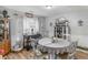 Cozy dining room features wood floors, wainscoting, and a lovely display cabinet for storage and decor at 710 Freeman Dr, Covington, GA 30016