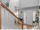 Bright entryway featuring a staircase and stylish decor with a wood-look floor and natural lighting at 710 Freeman Dr, Covington, GA 30016