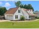 Exterior of a charming two-story home with a well-manicured lawn and a wrap-around porch at 710 Freeman Dr, Covington, GA 30016