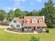 Aerial view of a beautiful two-story home with a large yard and mature trees at 710 Freeman Dr, Covington, GA 30016
