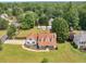 Charming home featuring a large front yard, covered porch, and lush landscaping creating a welcoming curb appeal at 710 Freeman Dr, Covington, GA 30016