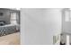 Hallway with a view into a bedroom, featuring a comfortable bed and a ceiling fan at 710 Freeman Dr, Covington, GA 30016